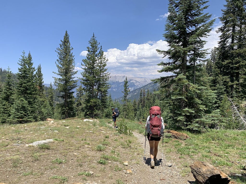 Woman hiking with a backpacking pack on