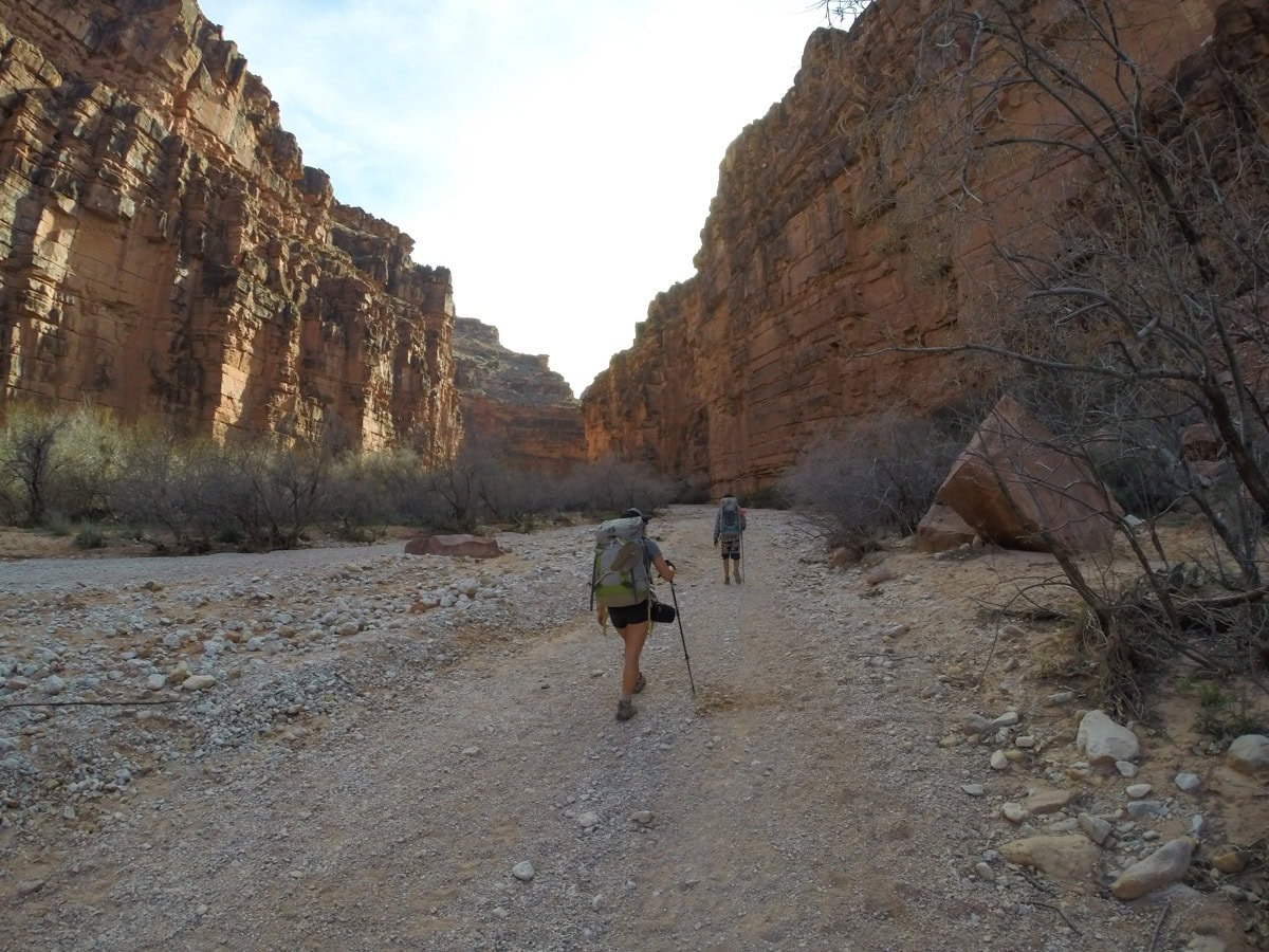 Hiker on a desert trail to Havasu Falls