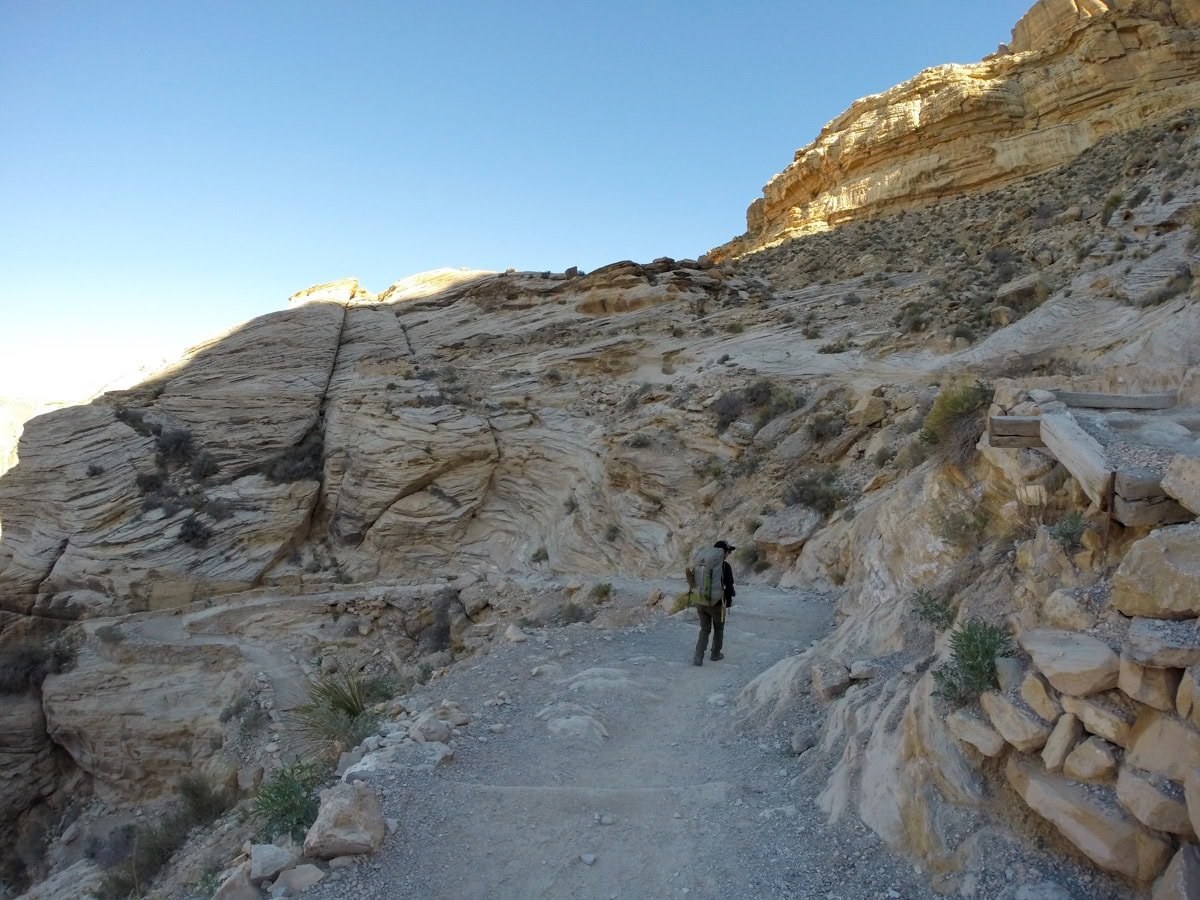 Hiker on a desert trail to Havasu Falls